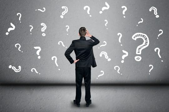 A man with question marks